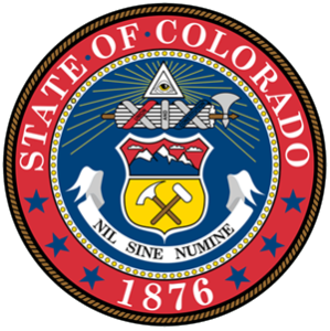 Colorado state seal featuring mining tools